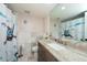 Updated bathroom with marble tile and granite vanity at 3006 Bolt Dr, Palm Harbor, FL 34685