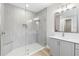 Spa-like bathroom with a large walk-in shower and gray tile at 4047 Southern Valley Loop, Brooksville, FL 34601
