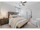 Cozy bedroom with wood bed frame and neutral tones at 4187 Southern Valley Loop, Brooksville, FL 34601