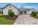 Craftsman style home with a paver driveway and landscaped front yard at 4187 Southern Valley Loop, Brooksville, FL 34601