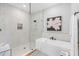 Spa-like bathroom with a large soaking tub, walk-in shower, and marble tile at 4187 Southern Valley Loop, Brooksville, FL 34601