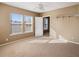 Inviting bedroom featuring three large windows and a closet rack, providing ample natural light and storage at 500 53Rd S St, St Petersburg, FL 33707