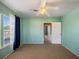 Bright bedroom with ceiling fan and large windows with views, creating a tranquil retreat at 500 53Rd S St, St Petersburg, FL 33707