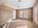 Cozy bedroom with ceiling fan, closet rack, and bright windows, providing a comfortable living space at 500 53Rd S St, St Petersburg, FL 33707