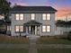 Two-story house with gray siding, dark trim, and a well-lit entrance at 500 53Rd S St, St Petersburg, FL 33707