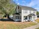 Two-story house with gray siding, dark trim, and a large front yard at 500 53Rd S St, St Petersburg, FL 33707