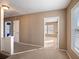 Bright hallway with neutral tones, connecting multiple rooms with ample natural light and carpeted floors at 500 53Rd S St, St Petersburg, FL 33707