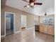 Kitchen with tile floors, stainless steel appliances, and laundry access at 500 53Rd S St, St Petersburg, FL 33707