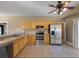 Bright kitchen, stainless steel appliances, light wood cabinets, and tile floors at 500 53Rd S St, St Petersburg, FL 33707