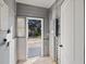 Laundry room with exterior access and built-in shelving at 500 53Rd S St, St Petersburg, FL 33707