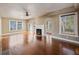 Open-concept living area with hardwood floors, fireplace, and ample natural light at 500 53Rd S St, St Petersburg, FL 33707