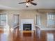 Bright living room features a fireplace, windows with blinds, and beautiful hardwood floors at 500 53Rd S St, St Petersburg, FL 33707