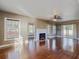Living room with hardwood floors, fireplace, and lots of natural light at 500 53Rd S St, St Petersburg, FL 33707