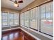 Inviting sunroom filled with natural light from multiple windows overlooking the neighborhood at 500 53Rd S St, St Petersburg, FL 33707