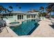 Outdoor pool and lanai for entertaining at 501 Harbor Dr, Belleair Beach, FL 33786