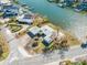 An aerial view showcasing a house near the water at 5412 Pali Way, St Pete Beach, FL 33706