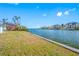 Canal front property with lush grass and upscale neighboring homes at 5412 Pali Way, St Pete Beach, FL 33706