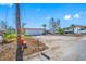 A white single-story house with an attached garage, needs some repairs at 5412 Pali Way, St Pete Beach, FL 33706