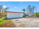 Property awaiting renovation, featuring a large garage at 5412 Pali Way, St Pete Beach, FL 33706