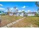 Side view of home showing walkway and canal view at 5412 Pali Way, St Pete Beach, FL 33706