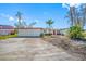 Home exterior showcasing storm damage and renovation potential at 5412 Pali Way, St Pete Beach, FL 33706