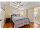 Cozy bedroom with hardwood floors and en-suite bathroom access at 806 Bamboo S Dr, St Petersburg, FL 33707