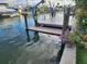 Private boat lift and dock with beautiful flowers at 8525 42Nd N Ave, St Petersburg, FL 33709