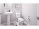 Simple and clean bathroom with pedestal sink and toilet at 8607 Canyon Creek Trl, Parrish, FL 34219