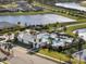 Community pool with clubhouse and surrounding landscaping at 8607 Canyon Creek Trl, Parrish, FL 34219