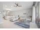Open living room featuring light walls, a sofa, and a view into the kitchen at 8607 Canyon Creek Trl, Parrish, FL 34219