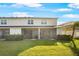 Expansive backyard with lush green grass and a screened-in patio, perfect for entertaining at 8607 Canyon Creek Trl, Parrish, FL 34219