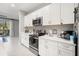 Clean and spacious kitchen with white cabinets and stainless steel appliances at 8607 Canyon Creek Trl, Parrish, FL 34219