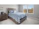 Bright bedroom with plush carpeting and large window at 8607 Canyon Creek Trl, Parrish, FL 34219