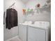 Laundry room with washer, dryer and shelving at 8607 Canyon Creek Trl, Parrish, FL 34219