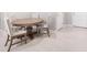 Charming dining area with wood table and four upholstered chairs at 8607 Canyon Creek Trl, Parrish, FL 34219