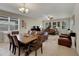 Elegant dining room with a large table and chandelier at 11538 Tangle Branch Ln, Gibsonton, FL 33534