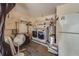 Laundry room with washer, dryer, and extra storage at 140 Meadowlark Dr, Safety Harbor, FL 34695