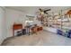 Functional home office with a desk, shelving, and ample natural light at 140 Meadowlark Dr, Safety Harbor, FL 34695