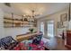 Bright dining room with a wooden table and industrial-style lighting at 140 Meadowlark Dr, Safety Harbor, FL 34695