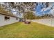 Spacious backyard with fire pit and seating area at 140 Meadowlark Dr, Safety Harbor, FL 34695