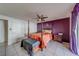 Main bedroom with a post bed, orange bedding, and ceiling fan at 140 Meadowlark Dr, Safety Harbor, FL 34695