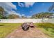 Spacious patio with fire pit and seating area at 140 Meadowlark Dr, Safety Harbor, FL 34695