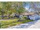Nice home on a tree-lined street with a large front yard at 140 Meadowlark Dr, Safety Harbor, FL 34695
