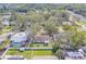 Home with fenced backyard, pool, and shed in a tree-lined area at 140 Meadowlark Dr, Safety Harbor, FL 34695