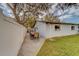 Large backyard with spacious patio and grassy area at 140 Meadowlark Dr, Safety Harbor, FL 34695