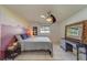 Spacious bedroom featuring a large bed, decorative wall, and a full-length mirror at 140 Meadowlark Dr, Safety Harbor, FL 34695