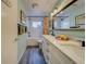 Updated bathroom with double vanity, a soaking tub, and modern fixtures at 140 Meadowlark Dr, Safety Harbor, FL 34695