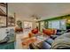 Open concept living room with a view into the dining area at 140 Meadowlark Dr, Safety Harbor, FL 34695