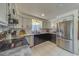 Updated kitchen featuring stainless steel appliances and white cabinets at 140 Meadowlark Dr, Safety Harbor, FL 34695