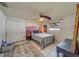 Bright bedroom with a queen bed, wall art, and ample closet space at 140 Meadowlark Dr, Safety Harbor, FL 34695